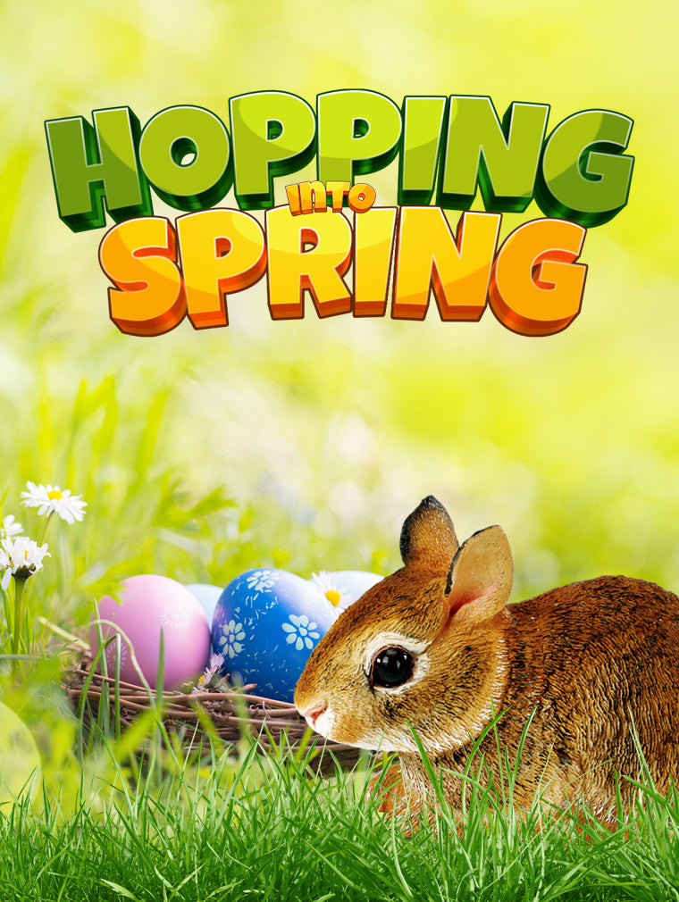 A brown rabbit sits in grass near a nest with colorful Easter eggs. The background is bright and green, with daisies and the text Hopping Into Spring at the top in bold, colorful letters.