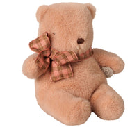 The Maileg Teddy bear plush, Mini - Vintage rose by Maileg is a soft, light brown teddy bear that sits upright, featuring a pink and green plaid bow around its neck. With small black eyes, a brown nose, and a round body with gently floppy arms and legs, it perfectly embodies the classic Maileg style—reminiscent of a vintage rose charm.