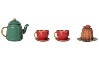 Maileg Christmas tea party, Mouse - Red/Green by Maileg features a charming green teapot, two red teacups with matching saucers, and a petite brown dessert with red topping on a plate, all beautifully arranged against a crisp white background—the perfect festive set for holiday celebrations or to add magic to any Maileg mice Christmas play scene.