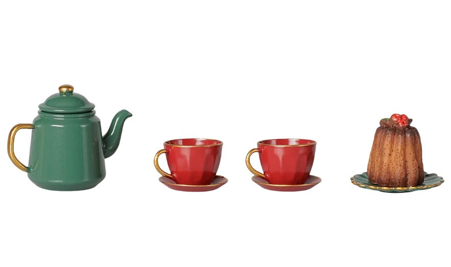 Maileg Christmas tea party, Mouse - Red/Green by Maileg features a charming green teapot, two red teacups with matching saucers, and a petite brown dessert with red topping on a plate, all beautifully arranged against a crisp white background—the perfect festive set for holiday celebrations or to add magic to any Maileg mice Christmas play scene.