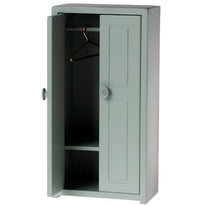 The Maileg Closet, Mouse - Soft Blue by Maileg features one open door, a hanging rod with a metal hanger, and two shelves—a charming dollhouse furniture piece ideal for organizing Maileg Mouse accessories.
