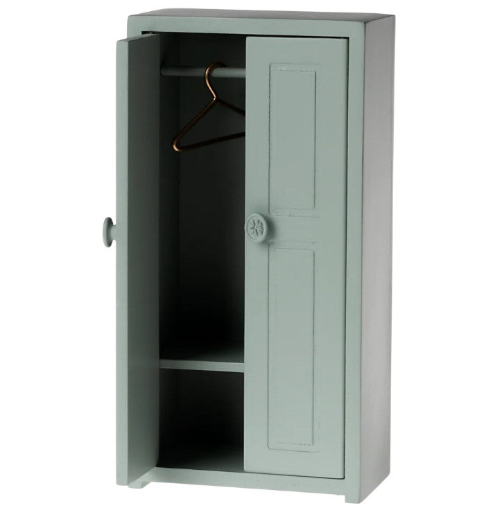 The Maileg Closet, Mouse - Soft Blue by Maileg features one open door, a hanging rod with a metal hanger, and two shelves—a charming dollhouse furniture piece ideal for organizing Maileg Mouse accessories.