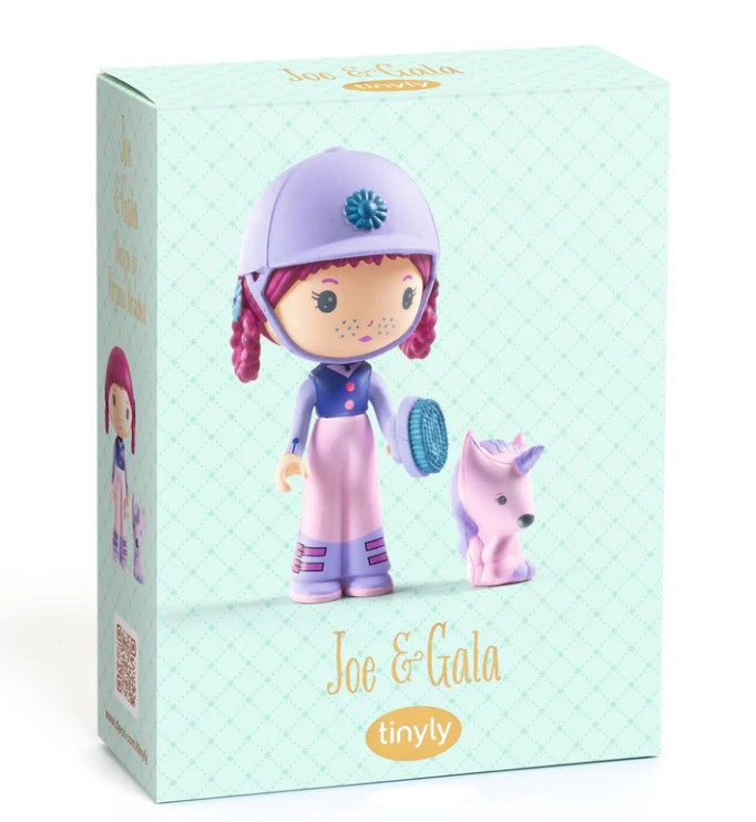 Box featuring the DJECO Tinyly Joe & Gala toy set from DJECO, displaying a girl collectible figure with a helmet and braided hair standing beside a small purple unicorn on the front of the packaging.