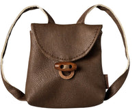 The Maileg Backpack, Medium mouse by Maileg is a small brown leather miniature backpack featuring a flap closure, looped strap, and a simple buckle detail on the front—perfect for imaginative play with your Medium Mouse companion. Displayed against a white background.