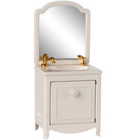 The Maileg Sink Dresser, Mouse - Off White by Maileg is a charming vintage-style vanity with a gold faucet, rectangular mirror, and cabinet—ideal for Maileg bathroom setups or as a whimsical sink for mouse-sized imaginative play.