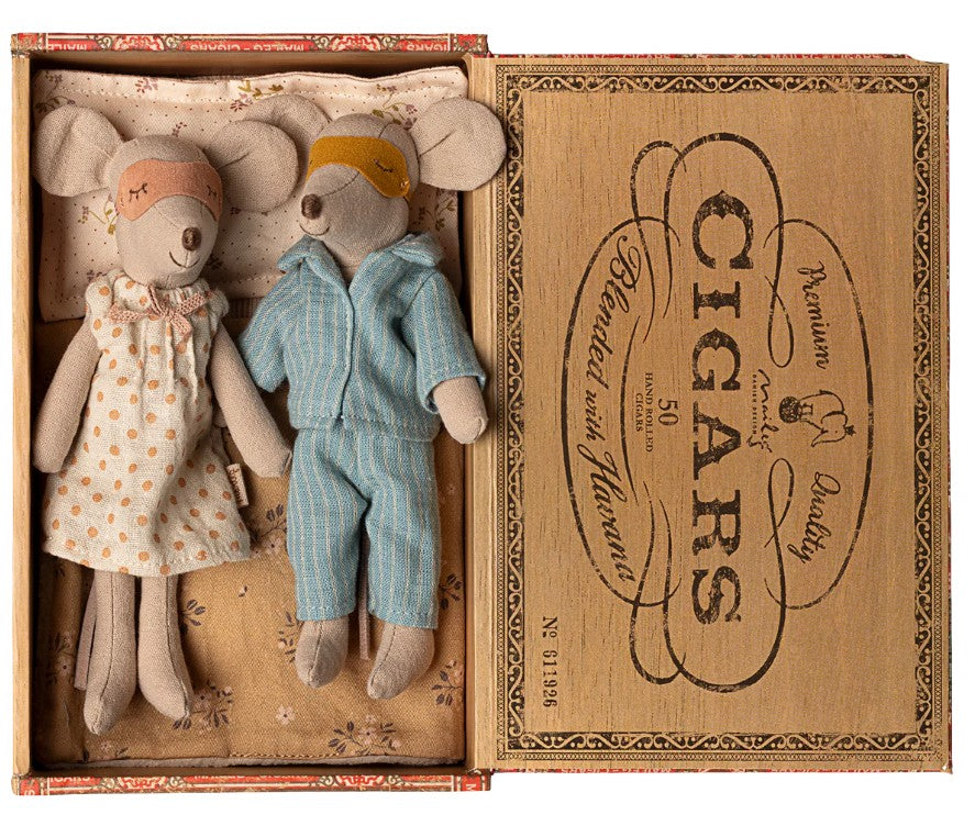 Maileg Mum & Dad Mice In Cigarbox by Maileg features two mice wearing sleepwear and masks, nestled together in a cozy cigar box bed.