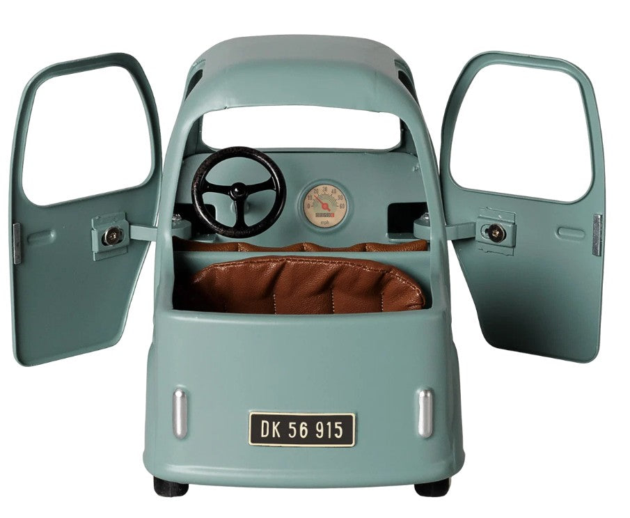 A small, vintage-style Maileg Truck, Mouse by Maileg in light blue features both doors open to reveal a brown seat, black steering wheel, and visible speedometer inside. The license plate reads DK 56 915—perfectly mouse-sized for miniature adventures.
