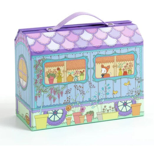 The DJECO Tinyly Bluchka & Indie House by DJECO is a colorful, illustrated box shaped like a caravan, adorned with flowers, pots, and a cat peeking out of a window. Featuring a purple handle on top, the box opens to reveal an enchanting miniature Tinyly house—a delightful playset perfect for housing Tinyly figurines.