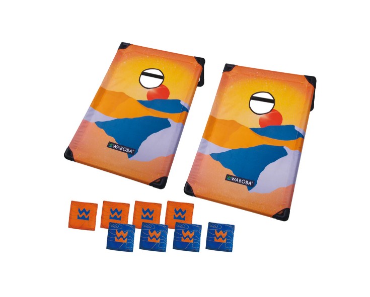 The Waboba Corn Hole Travel Set by Waboba features two colorful cornhole boards with abstract mountain designs and includes eight bean bags—four orange and four blue—arranged on a white background, creating a vibrant, portable game perfect for fun on the go.