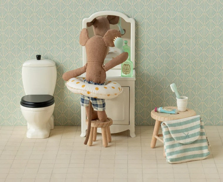 Maileg Beach Mouse With Float, Little Brother - Yellow Dots by Maileg features a cute mouse in plaid shorts and a yellow dotted swim ring—perfect for imaginative, beach-themed play adventures.