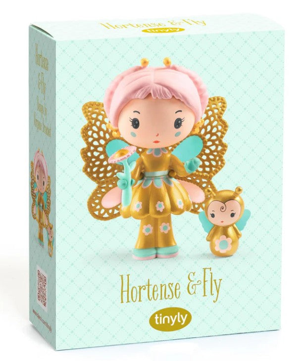 Discover DJECO Tinyly Hortense & Fly by DJECO—a beautifully designed box featuring Hortense, a whimsical fairy-like doll with butterfly wings, pink hair, and a flower wand, accompanied by her adorable bee companion, Fly. Set against a delicate patterned background, this charming set makes an ideal collectible and inspires hours of imaginative play.