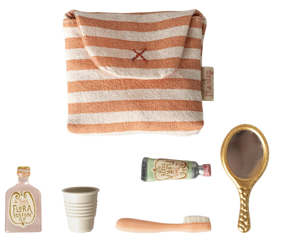 The Maileg Toothbrush Set In Bag, Mouse - Coral Stripe includes a striped fabric pouch, toothbrush, cup, crème tube, and hand mirror—adorable accessories by Maileg for pretend play or your Maileg mouse.