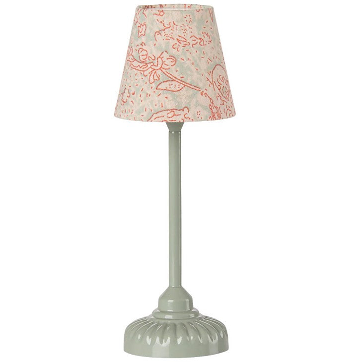 The Maileg Vintage Floor Lamp, Mouse - Mint by Maileg features a light green sculpted base and a fabric lampshade with a cream background and red floral pattern—perfect as a charming decorative accent.