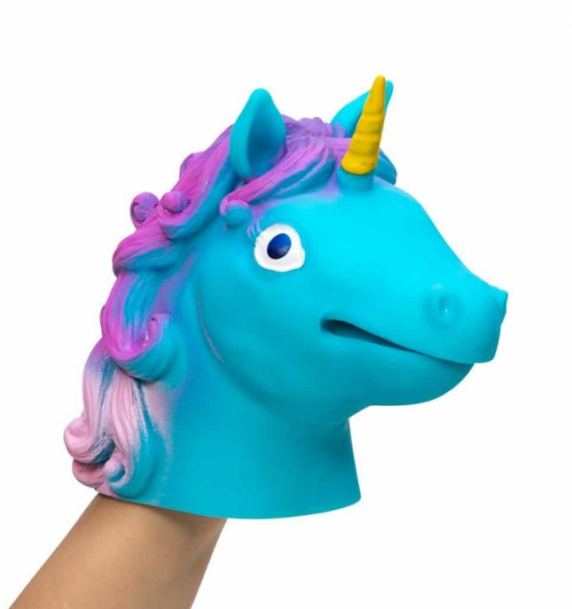 A hand displays the Schylling Toys Unicorn Hand Puppet—a vibrant blue mask featuring a yellow horn, wide eyes, and a pink and purple mane—set against a white background, perfect for sparking creative play or imaginative storytelling.