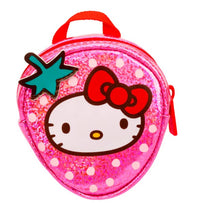 A cute, small pink glittery coin purse shaped like a strawberry with a cartoon cat face and red bow—featuring a green leaf and red handle on top—is part of the Moose Toys Real Littles Hello Kitty & Friends Backpacks collection by Toysmith, making it the perfect accessory for Sanrio fans or an adorable mini collectible backpack charm.