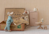 Maileg Mum & Dad Mice In Cigarbox set by Maileg features the mouse couple relaxing in their cozy cigar box bed, complete with a vintage-style table, tea cups, cake, and a cupboard with a teapot for extra charm.