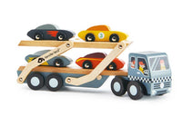 The Tenderleaf Car Transporter is a wooden truck with two levels and four colorful toy cars, featuring a grey cab with a painted driver and checkered stripes—ideal for imaginative play and hours of fun.