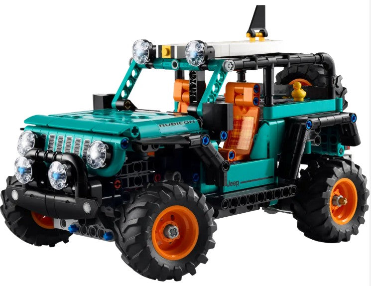 The LEGO Jeep Wrangler Rubicon SUV by LEGO is a model of a green Jeep Rubicon featuring orange wheels, realistic tires, a detailed interior, and functional headlights. This off-road SUV is displayed on a white background.