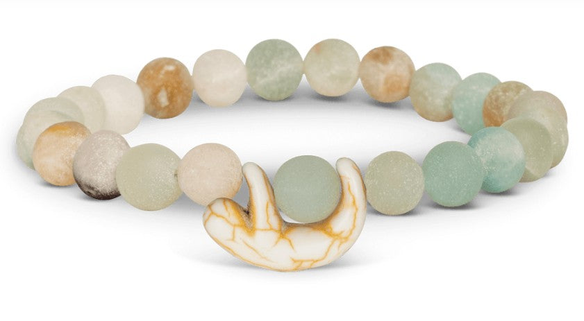 The fahlo Wander - Sky Stone Sloth bracelet features round, matte blue, green, beige, and cream beads with a sloth charm—ideal for wildlife conservation supporters.
