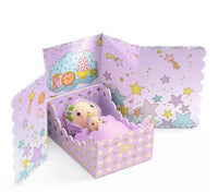The DJECO Tinyly Violet Tinyroom is a delightful miniature room playset from DJECO, featuring a doll and a small plush toy nestled in a purple, star-patterned box with illustrated scalloped backdrop panels adorned with stars, clouds, and cookies—perfect for inspiring imaginative adventures with your favorite Tinyly characters.