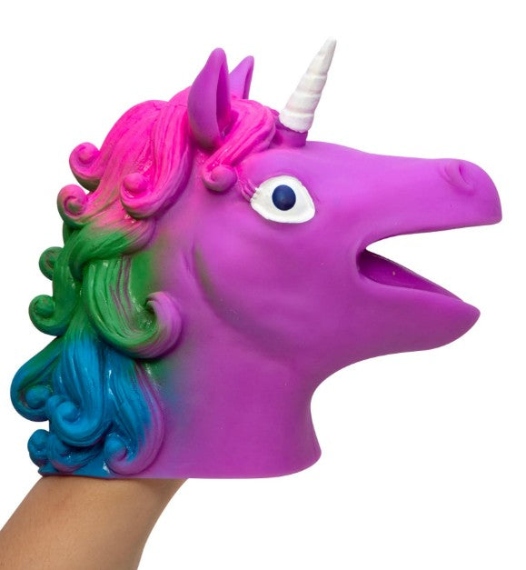 A person using the Schylling Toys Unicorn Hand Puppet, featuring a bright purple design with a white horn, pink mane, blue and green highlights, and wide eyes—perfect for imaginative play or adding a magical touch to storytelling.