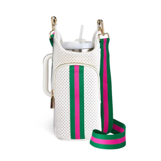 The Wander Full Brand HydroBag Handle White Neoprene is a water bottle holder in white, featuring green and pink stripes, gold hardware, and a green, pink, and navy striped shoulder strap with a comfortable neoprene handle. It includes a zippered pocket and holds a cup with a straw.