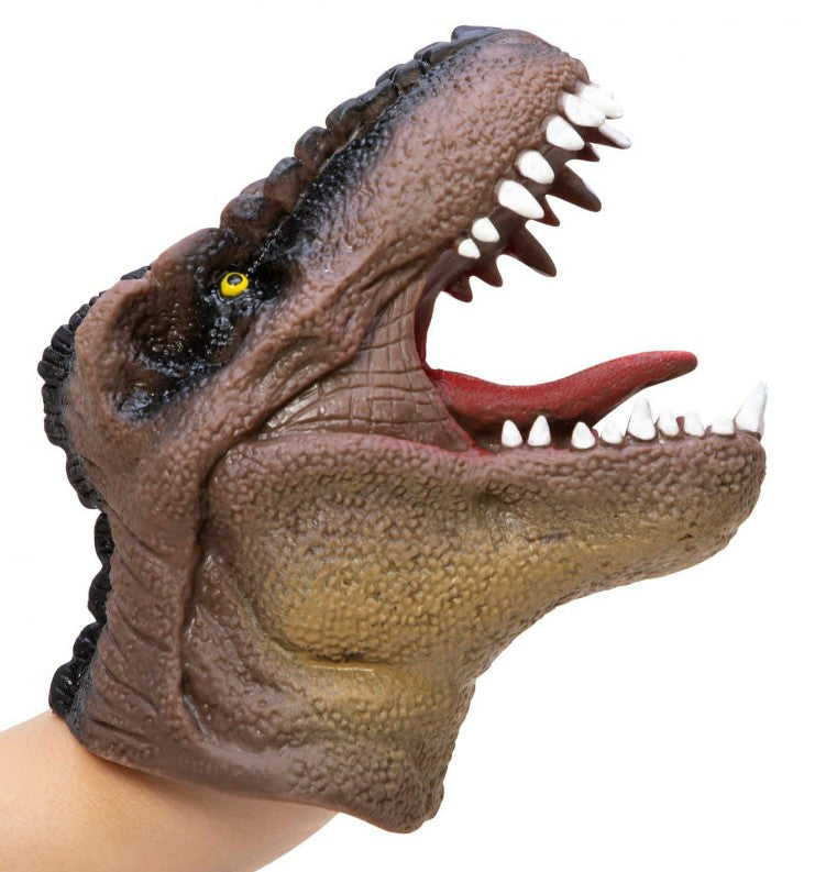 A person’s hand is inside the Schylling Toys Dinosaur Hand Puppet, designed to resemble a realistic T. rex with an open mouth displaying sharp teeth and a red tongue. Featuring brown textured skin and a yellow eye, this puppet is perfect for imaginative play and storytelling.