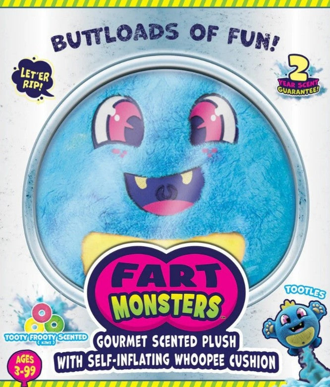 A blue, round plush toy named Tootles from Scentco’s 10" Fart Monsters collection beams with a big smile and pink eyes as it sits inside packaging marked "Fart Monsters." Part of the scented plush toys series, Tootles features a playful whoopee cushion function and delights with a unique raspberry candy scent. The box highlights the fragrance, interactive fun, and suitability for ages 3–99, with phrases like "BUTLOADS OF FUN!" and "LET ER RIP!" displayed above.