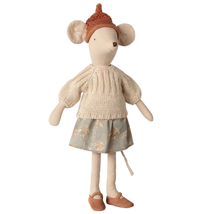 The Maileg Mouse, Medium - Skirt and Sweater by Maileg is a delightful medium-sized toy, perfect for imaginative play, featuring a mouse standing upright dressed in a brown knit hat, cream sweater, floral skirt, and brown shoes.
