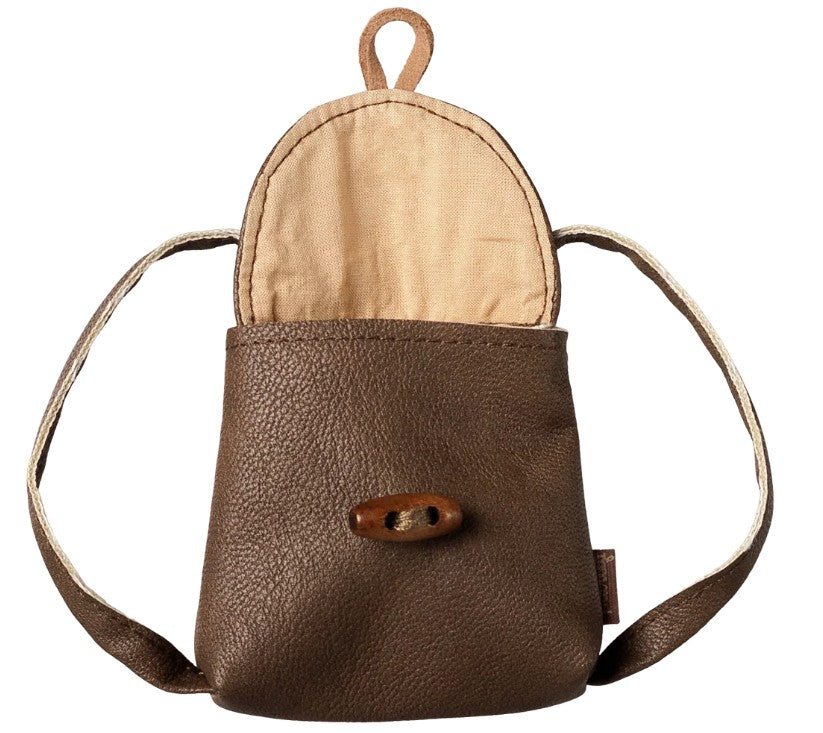 The Maileg Backpack, Medium Mouse by Maileg is a small brown leather miniature backpack featuring a flap opening, beige interior, two straps, and a wooden toggle button on the front—perfectly sized for Medium Mouse and ideal for imaginative play.