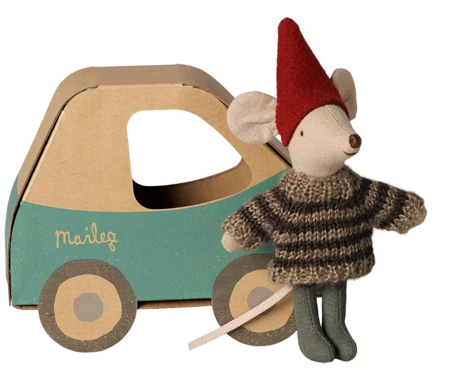 The Maileg Christmas Mouse, Little Brother in Car Box by Maileg features a small mouse wearing a red hat and striped sweater, standing next to a cardboard car box—ideal for festive storytelling and imaginative holiday play.