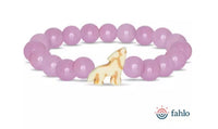 The Scout - Lilac Glow Wolf bracelet by fahlo features round lilac beads and a yellow wolf charm, supporting wolf conservation. The fahlo logo and text are displayed in the bottom right corner.