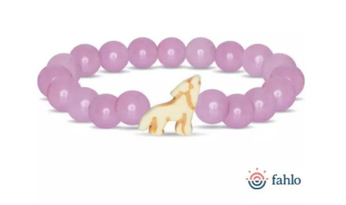 The Scout - Lilac Glow Wolf bracelet by fahlo features round lilac beads and a yellow wolf charm, supporting wolf conservation. The fahlo logo and text are displayed in the bottom right corner.