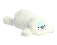 The 18" Snoozles Yeti by Aurora features extra-soft white fur, a light blue face, and embroidered details. Lying on its stomach with front paws stretched forward, this plush makes the perfect cuddling companion against a white background.