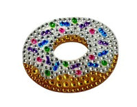 The StickerBean Vanilla Donut by StickerBean is a round, donut-shaped sticker adorned with shiny, colorful beads and rhinestones in gold, silver, green, purple, pink, and blue, resembling a cute donut sprinkled with vibrant decorations.
