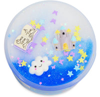 Bring some magic to your sensory play with this round container lid decorated with a smiling cloud, pastel castle, open “Once Upon a Time” book, and colorful star-shaped confetti on a blue and white glittery background—perfect for enhancing your Peachybbies Slime Enchanted Castle Slime collection.