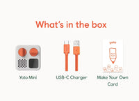 Image displays what's in the box: Yoto Mini (2024 Edition) by Yoto, orange USB-C charger, and Make Your Own Card, each clearly labeled with simple graphics on a white background.