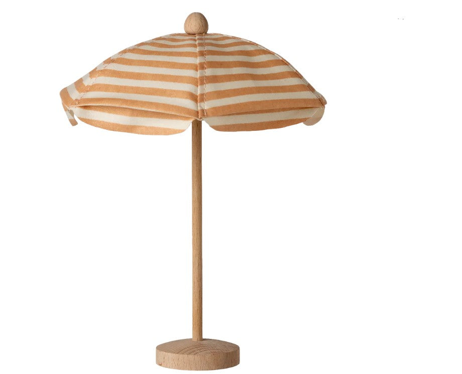 The Maileg Beach Umbrella, Mouse - Soft Coral by Maileg features a small wooden stand and a soft coral and white striped fabric umbrella, perfect for Maileg mice, shown against a plain white background.