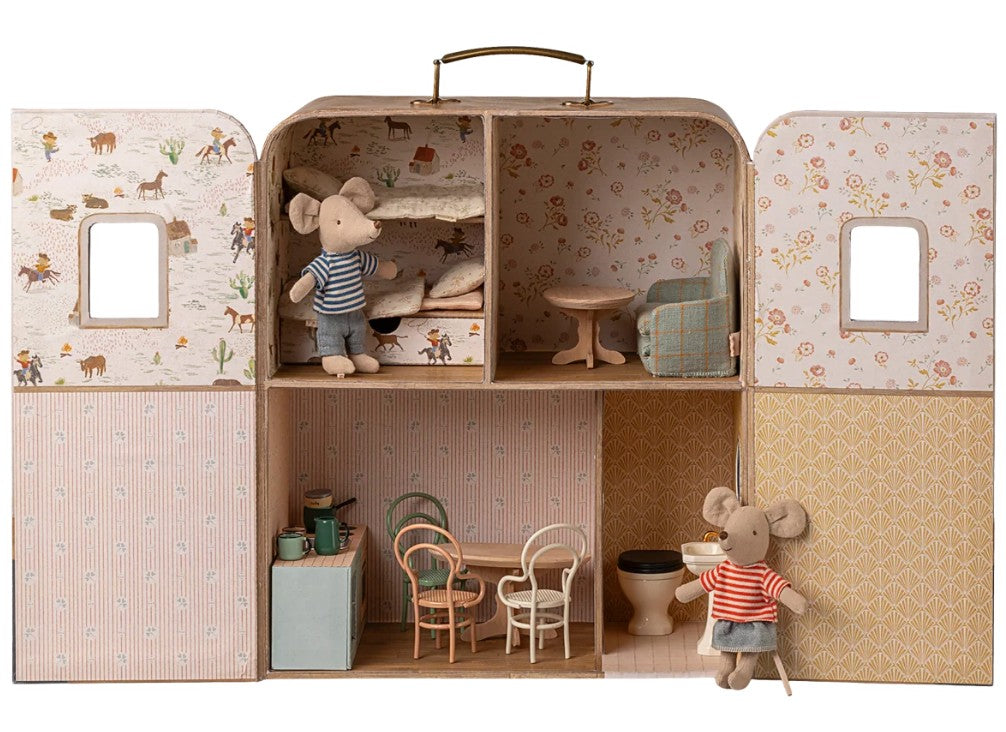 Bring home the Maileg SuitCasa, Little Sister and Brother Mouse set by Maileg—a charming mouse dollhouse featuring two mouse dolls, four intricately designed rooms, mini furniture pieces, and beautifully wallpapered walls for hours of imaginative play. Find Little Brother Mouse relaxing in the kitchen while Little Sister Mouse snuggles up in the bedroom’s bunk beds. For added fun and adventure, pair your SuitCasa with more Maileg accessories or tuck it into a miniature suitcase for on-the-go play!.