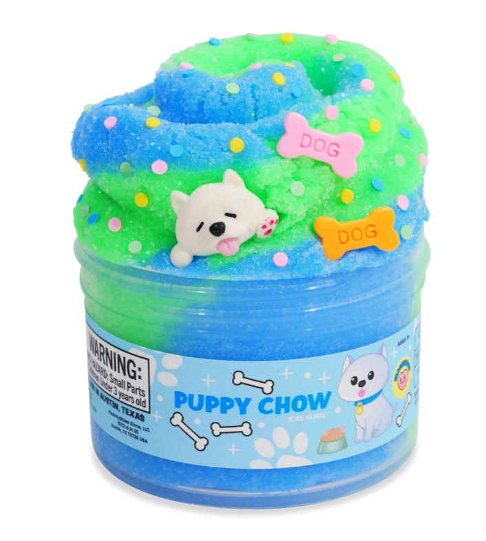 A jar of Peachybbies Slime’s Puppy Chow Slime offers a delightful sensory experience with its blue and green colors, topped with a cute dog figurine, colorful sprinkles, and bone-shaped decorations labeled “DOG.” The label reads "Puppy Chow" and showcases a cartoon dog with bones, making this handmade slime perfect for any puppy-themed collection.