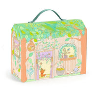 The DJECO Sylvia & Fox House is an illustrated box designed in the whimsical shape of a wooden Tinyly house, featuring animals, plants, and a green handle on top. The front displays a door, windows, flowers, and adorable animal characters peeking out—making it perfect for imaginative play or as a charming miniature playset by DJECO.