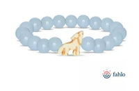 The Scout - Aqua Glow Wolf bracelet by fahlo features light blue round beads and a central howling wolf charm, supporting wildlife conservation. The fahlo logo appears in the bottom right corner.