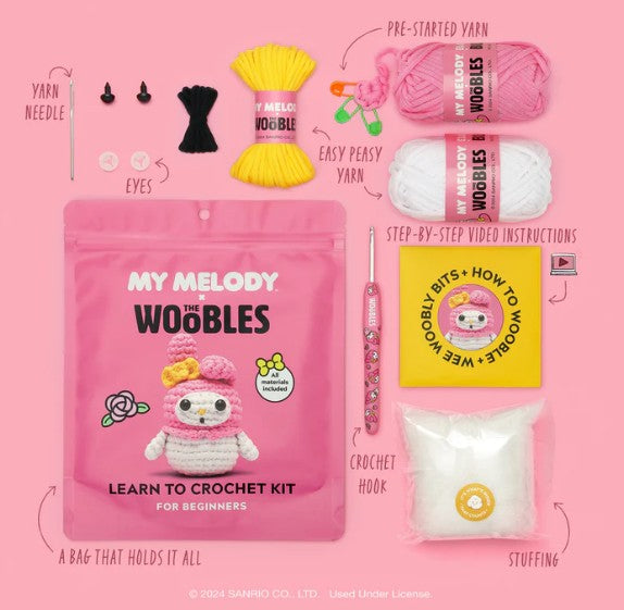 The Woobles My Melody Crochet Kit for beginners includes a project bag with a crocheted My Melody image, yarn needle, eyes, yarn, easy-peasy yarn, instructions, crochet hook, and stuffing.