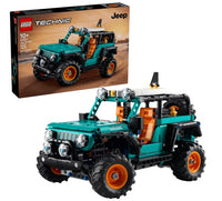 The LEGO Jeep Wrangler Rubicon SUV by LEGO features large tires and orange seats, displayed in front of its box that depicts the fully assembled off-road vehicle against a desert backdrop. Designed for ages 10 and up, this set includes 665 pieces.