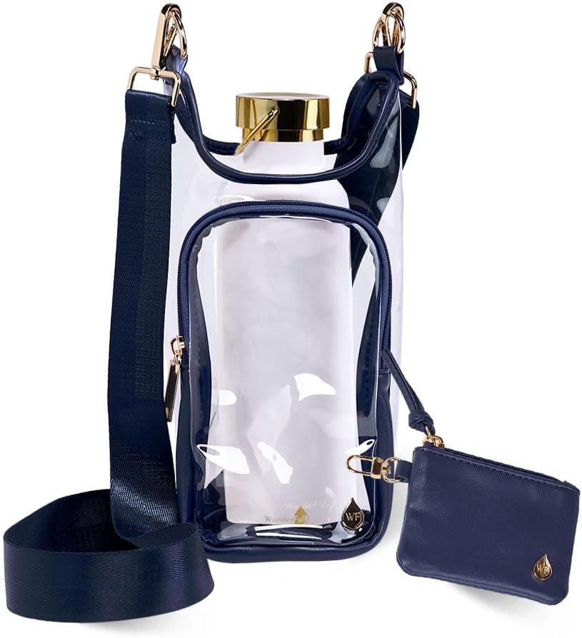 Introducing the Wander Full Brand Clear Stadium HydroBag Navy—this clear stadium-approved bag features navy blue trim, gold hardware, an adjustable strap, and a front zippered pocket. Designed for convenience as a crossbody hydrobag for events and outings, it comes with a matching small pouch attached and showcases a gold-capped water bottle holder inside the main compartment.