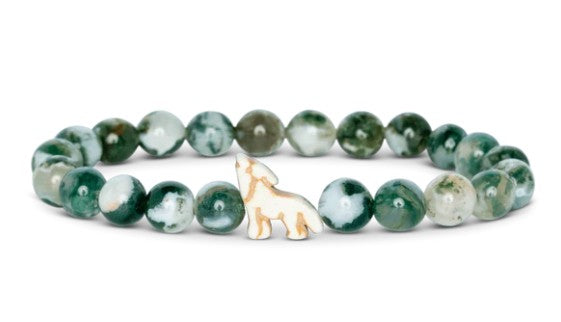 The Scout - Woodland Green Wolf bracelet by fahlo features round green and white beads with a white wolf charm, inspired by real-time wolf tracking adventures.