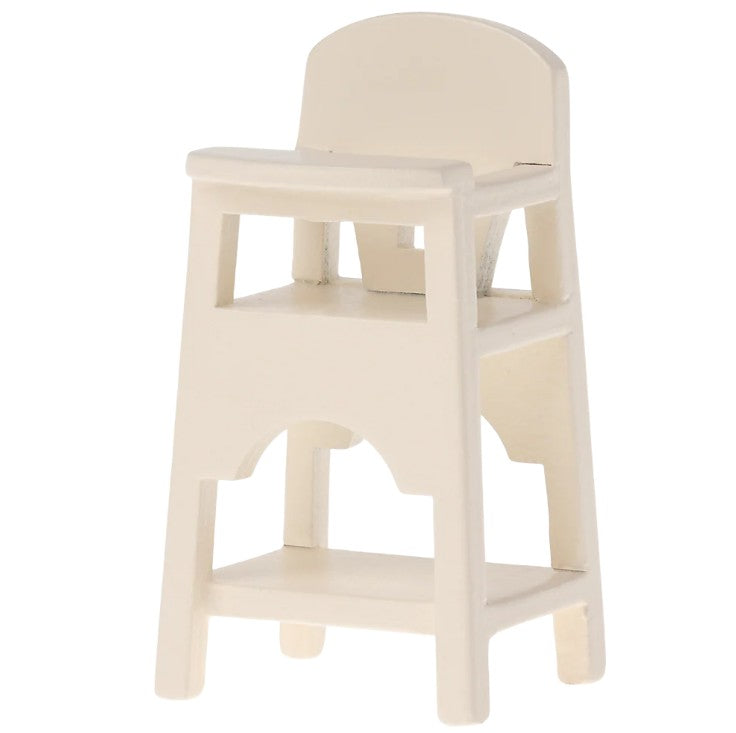 The Maileg High Chair, Mouse—Off White by Maileg is a small wooden chair with a curved backrest and footrest, ideal for seating Maileg baby mice or dollhouse play, shown against a plain white background.