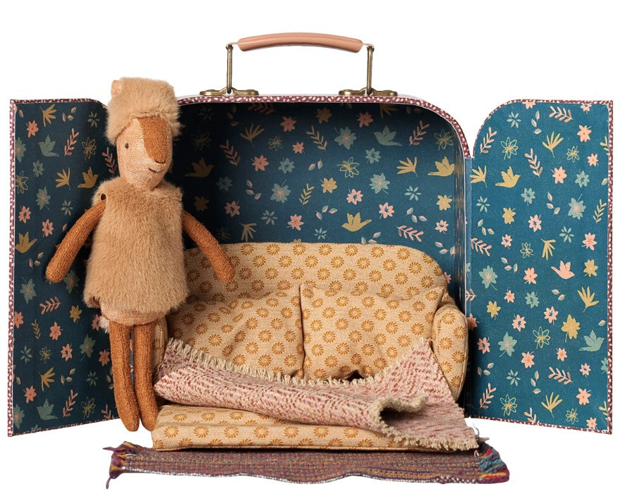 The Maileg Reindeer in Suitcase, Little Sister by Maileg features a charming floral-patterned mini suitcase containing a sweet brown plush reindeer, a yellow patterned pillow, and a pink blanket—all perfectly arranged inside and ideal for travel-themed imaginative play.