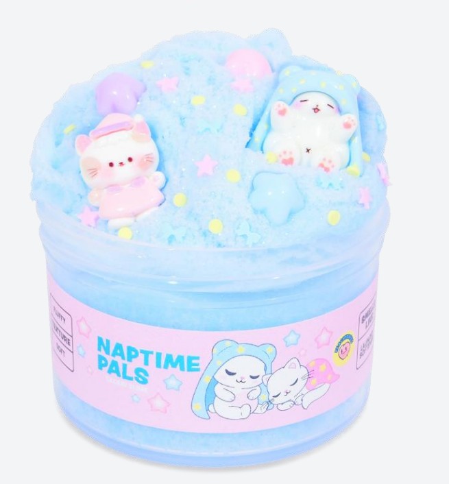 A jar of soft blue sensory slime from Peachybbies Slime, Naptime Pals is decorated with pastel accents and features adorable sleeping cat and bear figures on top. The label displays the name “NAPTIME PALS” alongside cute cartoon animals dozing beneath stars—perfect for calming moments or soothing fidgety hands.
