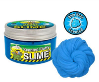 A blue container labeled "Toxic Waste Slime Licker Scented Fluffy Slime" from License 2 Play sits beside a swirl of vibrant blue slime, ideal for sensory play, and displays a Blue Razz Scented badge with a blue raspberry illustration inspired by the bold flavors of Toxic Waste Slime Licker.